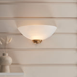 Wall light with an aged brass finish complete with a white painted glass shade. (0711WEL112439)