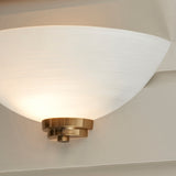 Wall light with an aged brass finish complete with a white painted glass shade. (0711WEL112439)