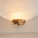 Wall light with an aged brass finish complete with a white painted glass shade. (0711WEL112439)