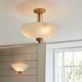 Wall light with an aged brass finish complete with a white painted glass shade. (0711WEL112439)