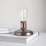 An industrial styled table top light, finished in aged pewter and aged copper (0711HAL76355)